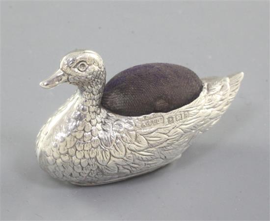 An Edwardian silver mounted novelty duck pin cushion, by Adie & Lovekin Ltd, length 56mm.